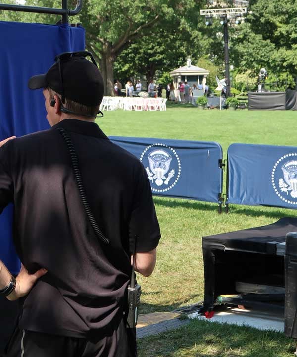 PM1 crew member on a radio at an event site