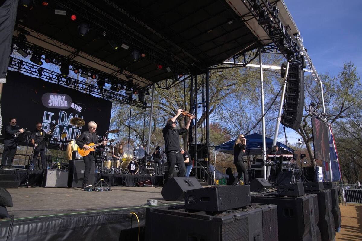 Gary Sinise and the Lt. Dan Band performing on a PM1 stage under the band banner