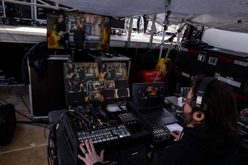 Engineer at the sound control position during an outdoor PM1 concert