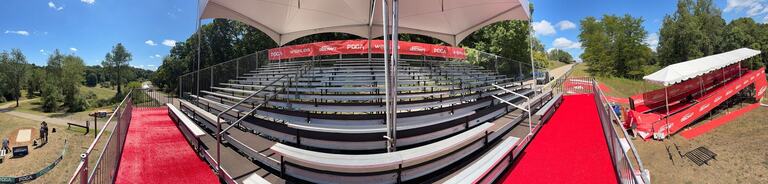 Covered PM1 grandstand with a white canopy at the 2026 PDGA Disc Golf World Championships