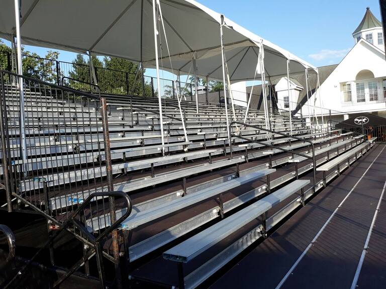 Tiered PM1 seating with a canopy over part of the rows