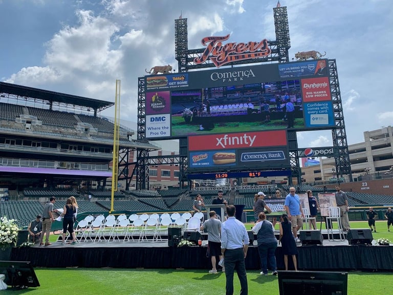 PM1 stage carrying a large LED screen on a stadium field