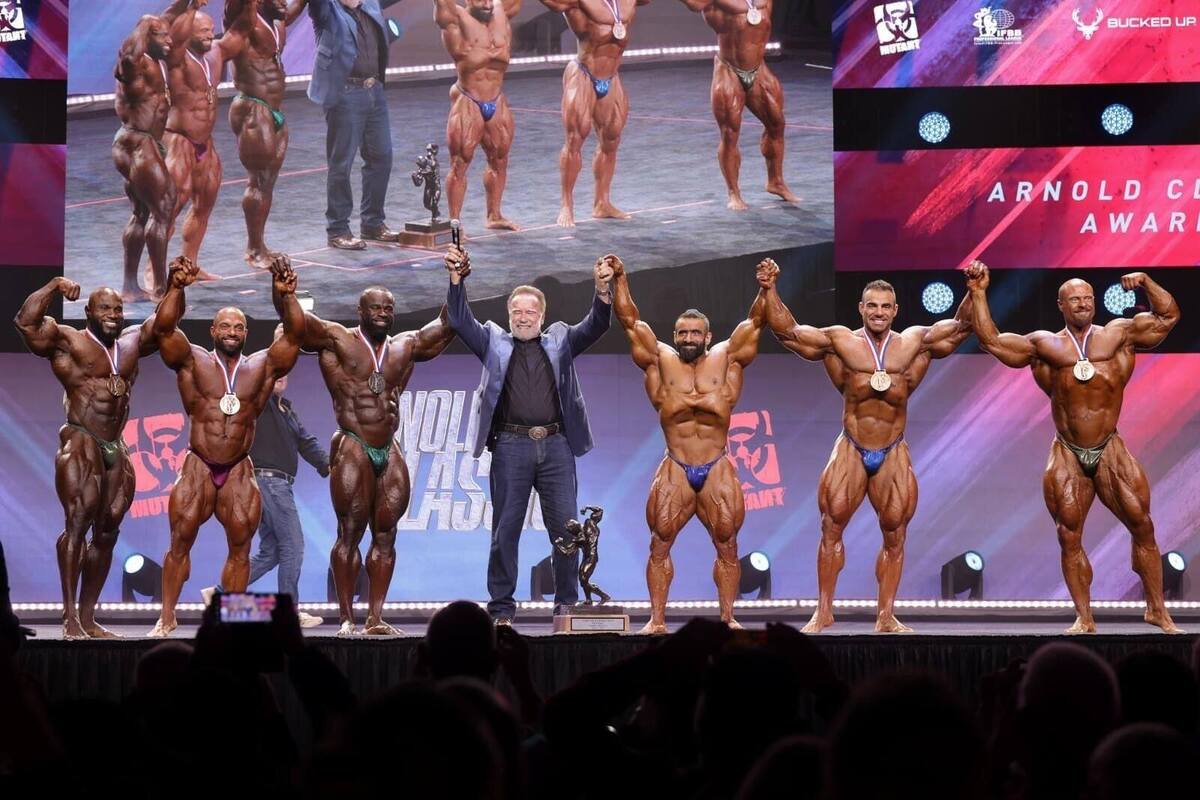 Award winners on a PM1 stage in front of a full-width LED screen
