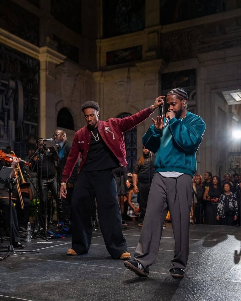 Vocalists with a horn and string section performing on a PM1 stage