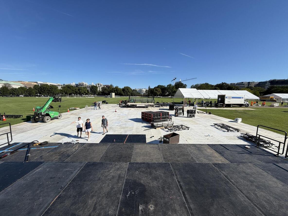 PM1 stage and ground protection going down on the Ellipse at the National Mall on day one of the build