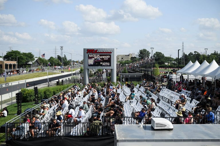 Crowd in PM1 VIP chair seating facing the video board at Roadkill Nights