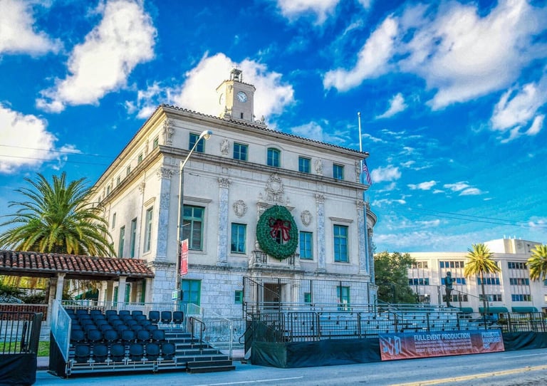 PM1 tip-up stadium seating set up outdoors in front of a historic building with a clock tower