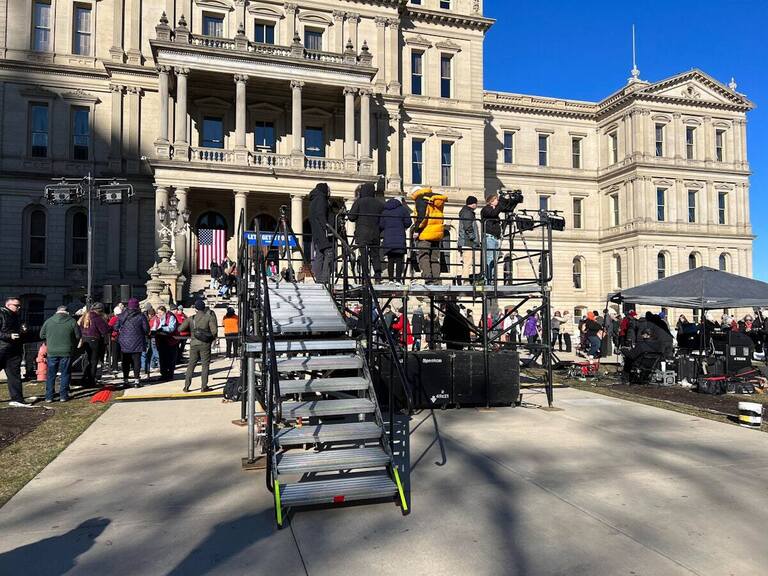PM1 press platform with cameras in front of the Michigan State Capitol