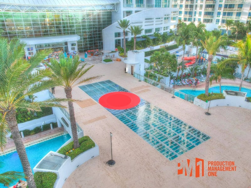 PM1 pool cover with a red circular graphic over the main pool at The Diplomat Beach Resort in Hollywood, Florida