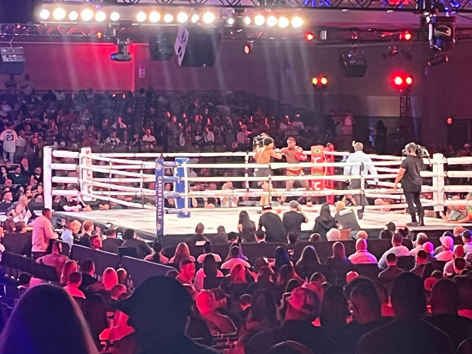 Boxing match set up in the middle of tiered risers 
