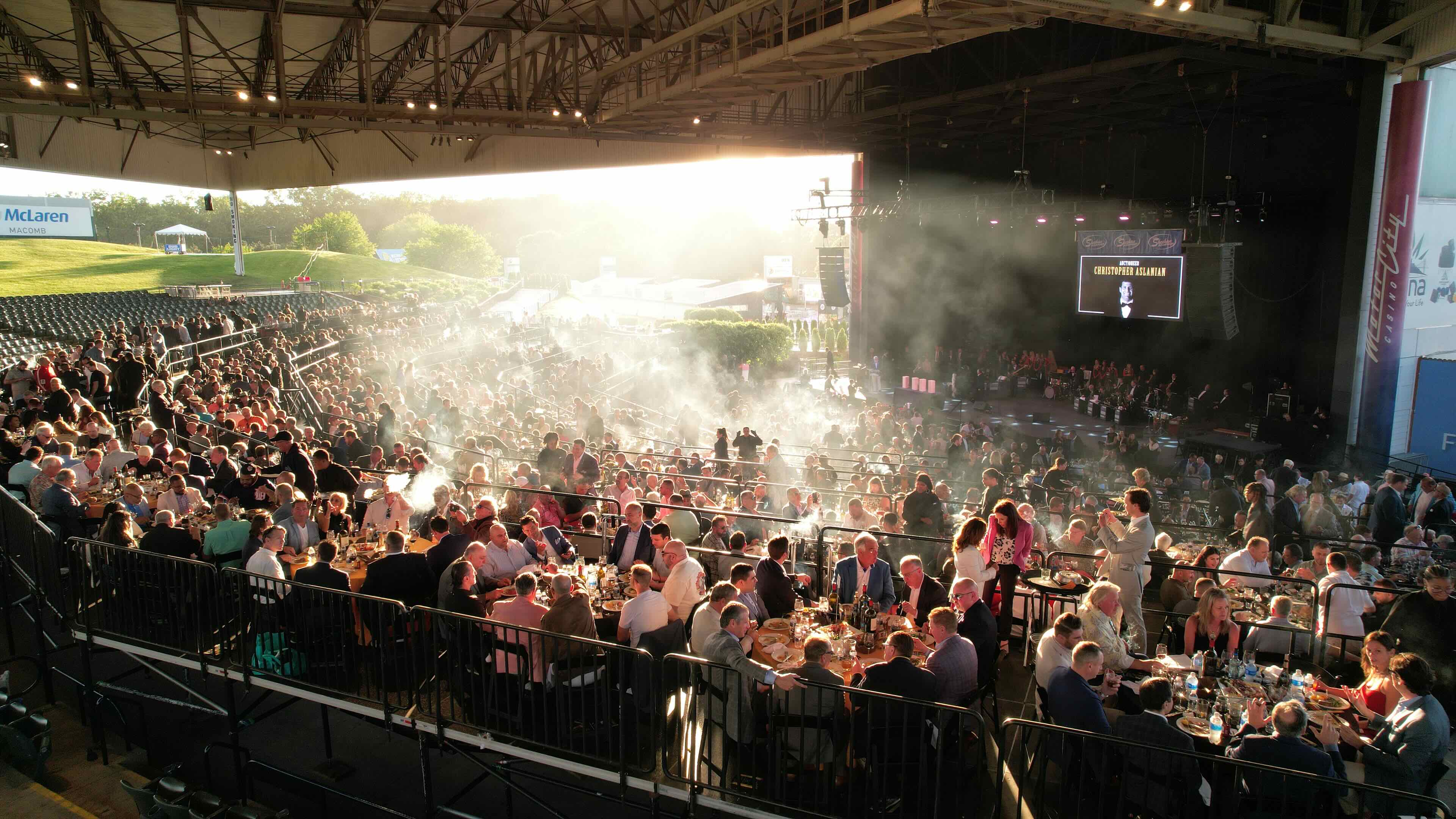 Dinner seating risers over amphitheater seatings during event