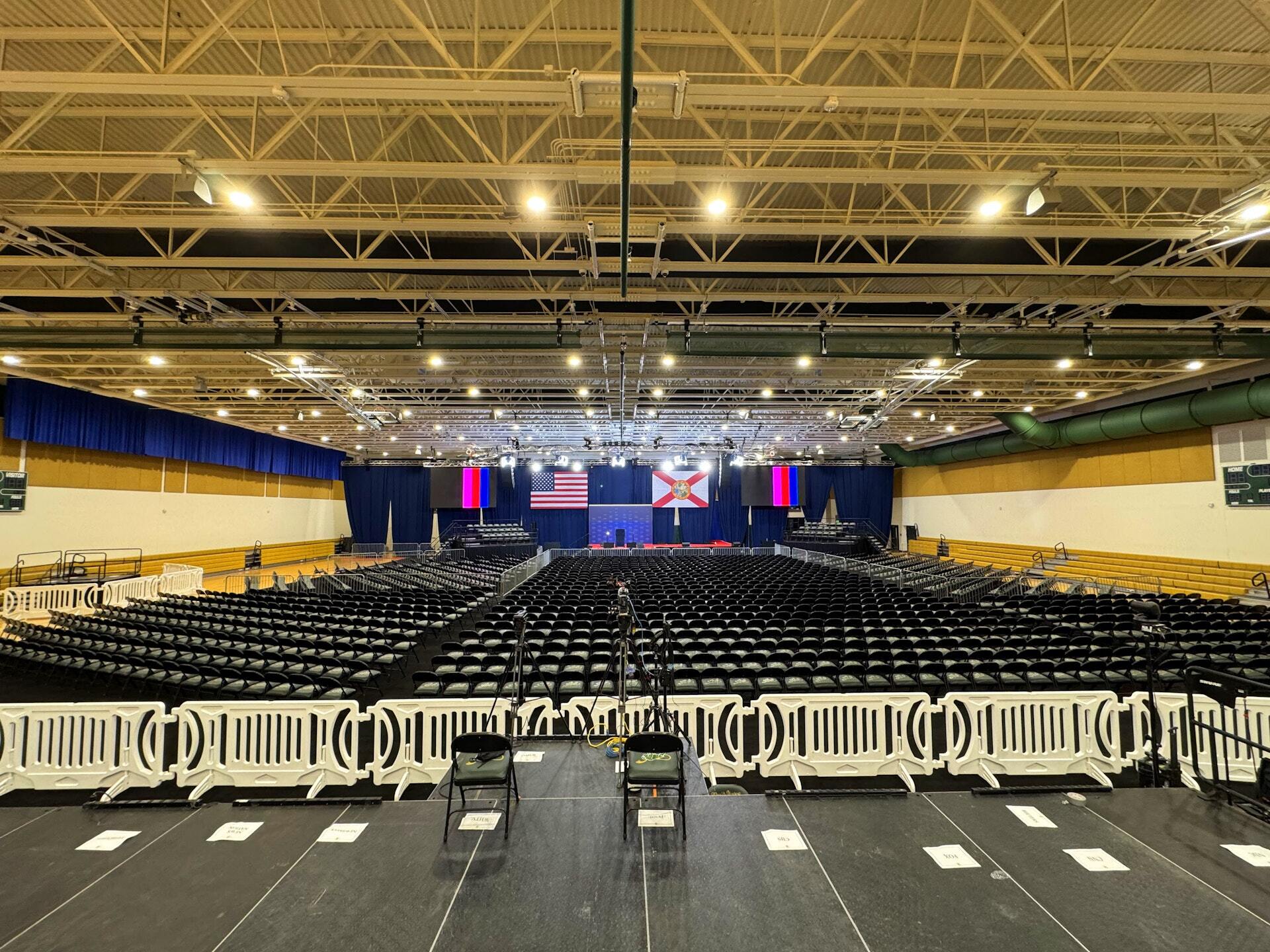 Rows of chairs set on a flat floor for an event