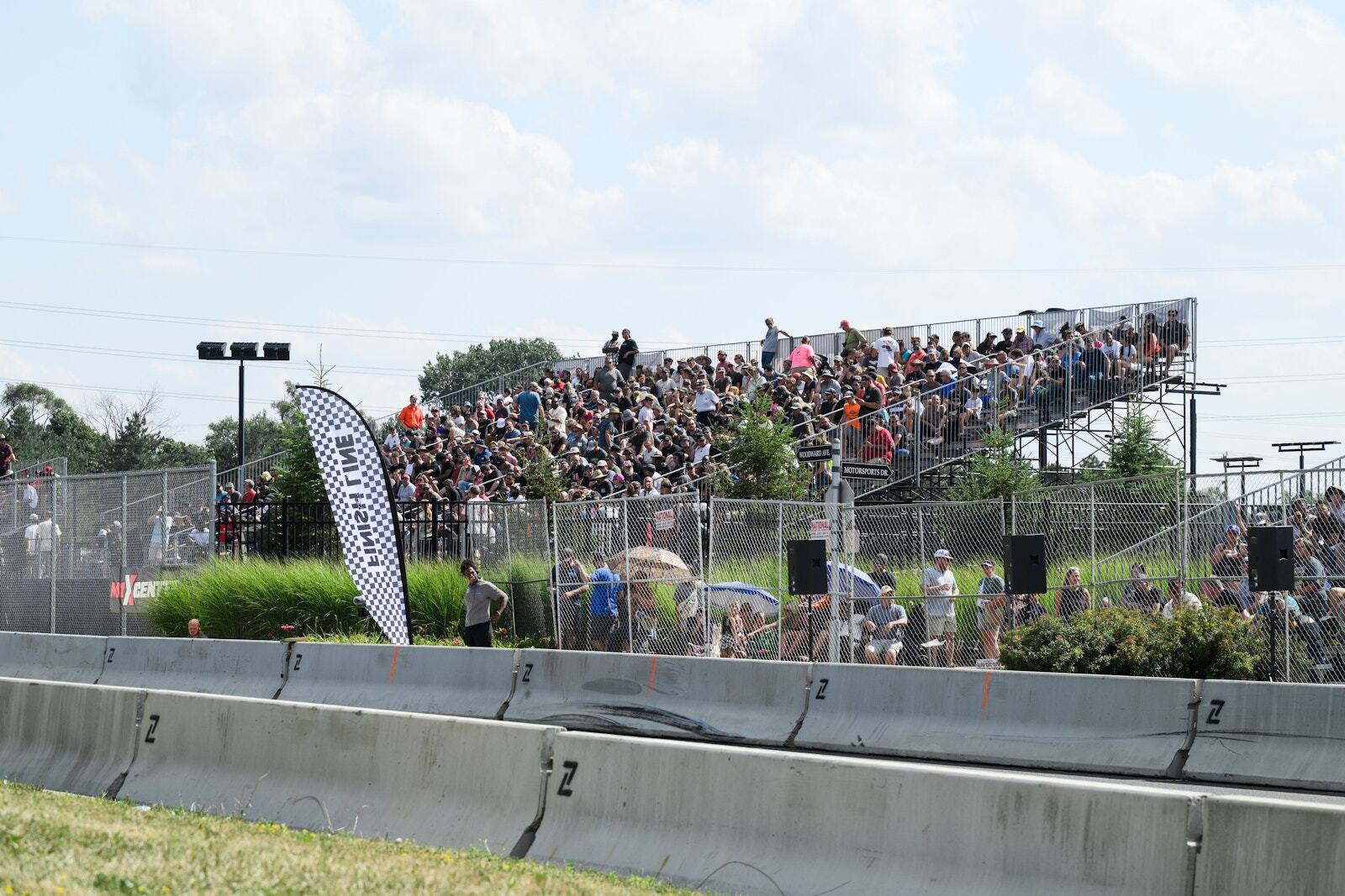 Full PM1 spectator grandstand at a street race on Woodward Avenue in Detroit