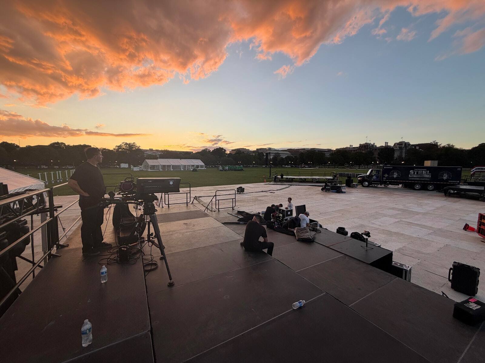 PM1 outdoor stage with a broadcast camera position beside it at sunset